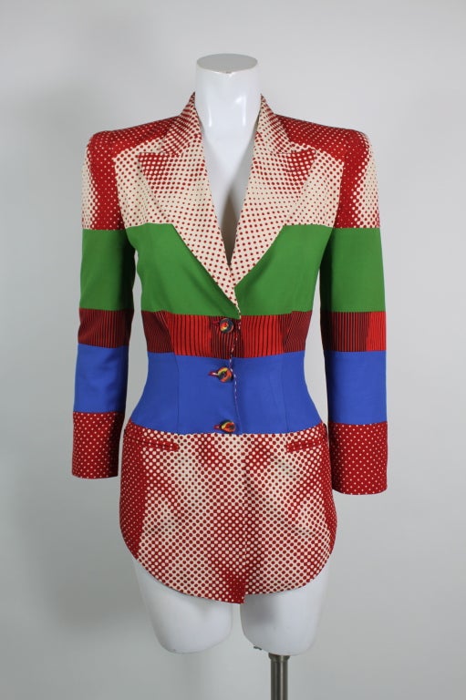 This incredible piece from Jean Paul Gaultier Femme is color blocked with a subtle op-art illusion design that, when looked at from afar, is a nude body. An incredible example of Gaultier's ability to balance creative expression with body-con