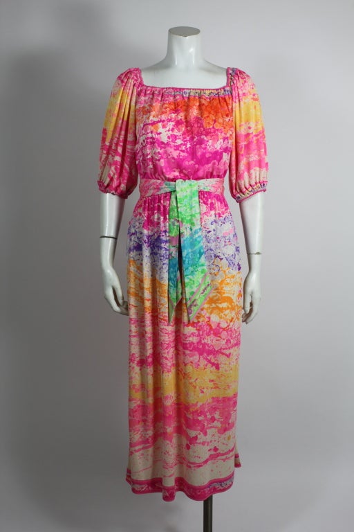 A gorgeous and unique multi-colored painterly print jersey dress from Leonard.  Slip-on style; no closures. Midi-length. Elasticized squared neckline, waist, and cuffs. Includes matching tie belt. Waist measurement listed is unstretched.
