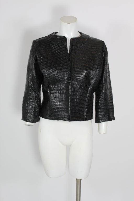 This one-of-a-kind black crocodile leather jacket is finely tailored with panels highlighting the natural beauty of the crocodile pattern. The leather is thick and sturdy, and the jacket is fully lined.

Three-quarter length sleeves. (sleeve length