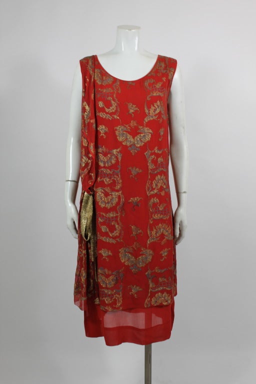 Luxuriously rich, crimson red 1920s party dress, accented with gold lamé sash and embroidery throughout. Slip on style. 