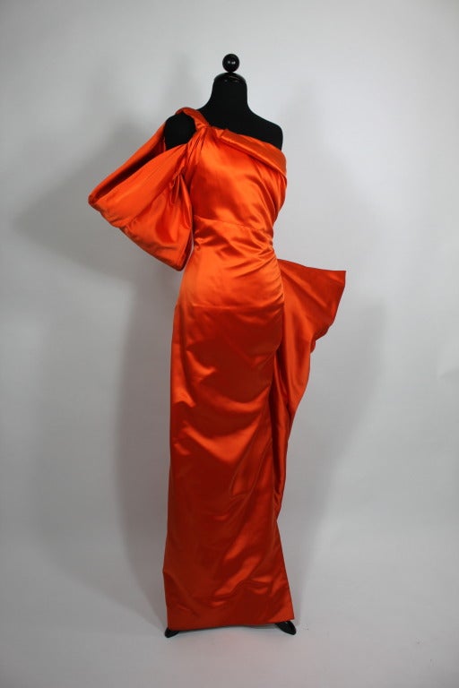 Stunning architectural gown from Jacqueline de Ribes done in striking tangerine silk.

Measurements:
Bust: 36â??
Waist: 28â??
Hip: 38â??
Length, Shoulder to Hem: approximately: 48â??

---------
Please contact The Way We Wore, Inc. directly