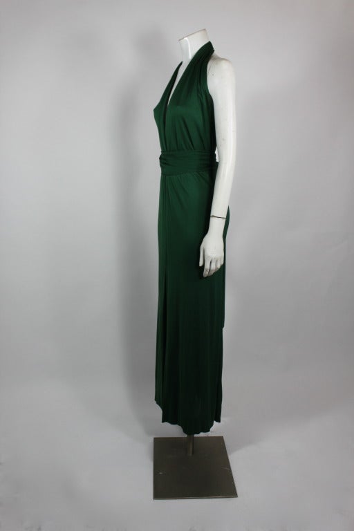 A gorgeous emerald green silk jersey gown from Halston done in the designers signature sexy, simple silhouette. Gown has accompanying belt.

Would best suit a US size 2/4. Please inquire for measurements.