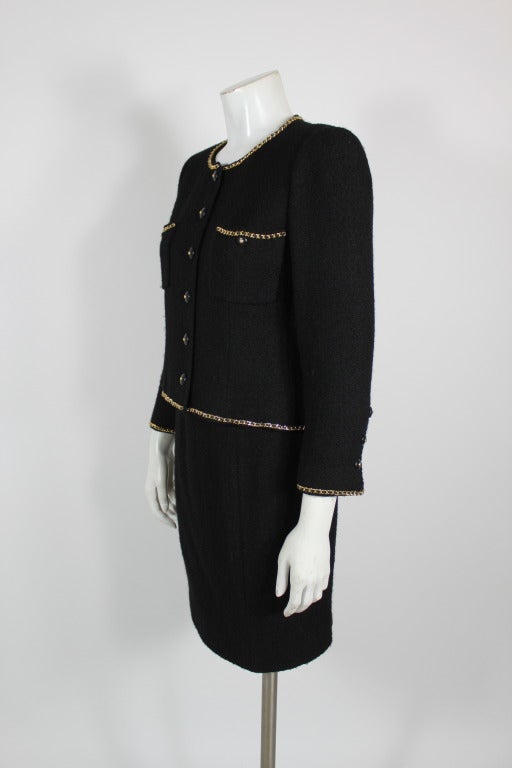 Chanel Black Bouclé Tweed Suit with Gold Chain Detail at 1stDibs