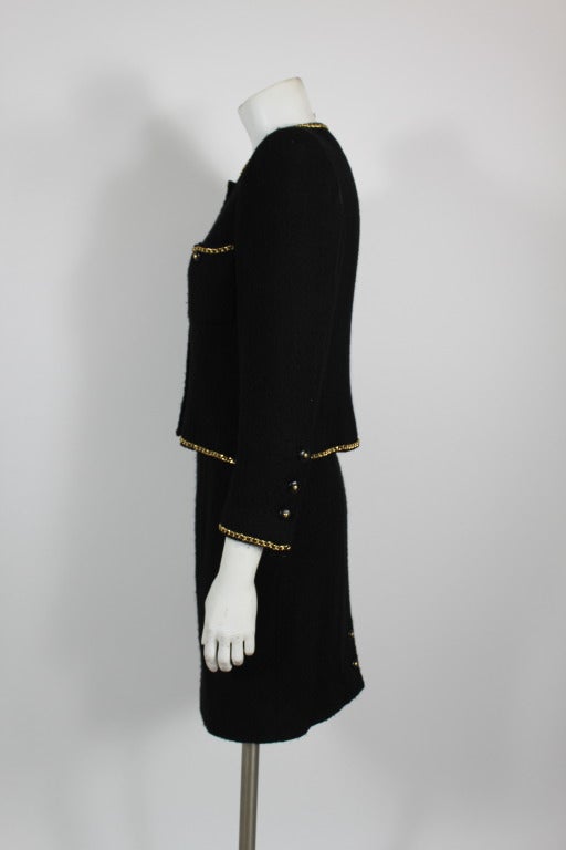 Chanel Black Bouclé Tweed Suit with Gold Chain Detail In Excellent Condition In Los Angeles, CA