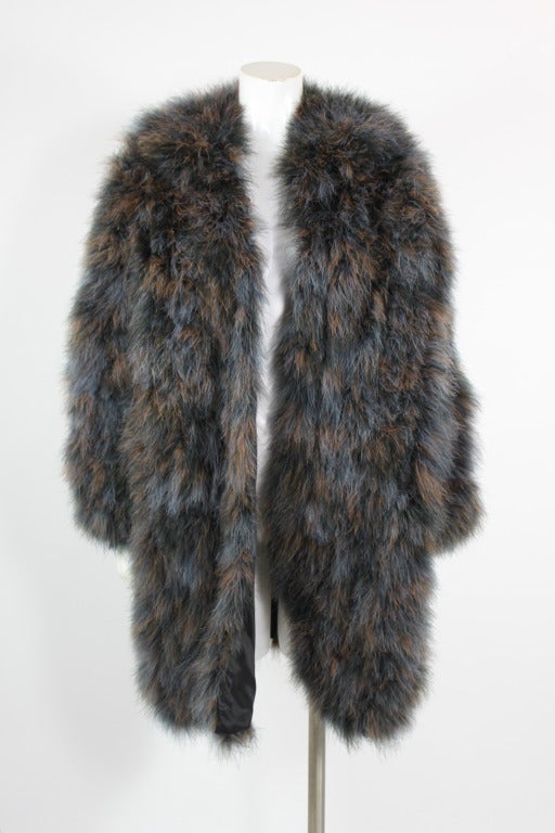 Stunning blue and brown marble maribou feather coat from Saint Laurent Rive Gauche. Jacket is fully covered in maribou feather and has a collar. Jacket has one hook-and-eye closure at top. Fully lined.

Measurements--
Bust: 46 inches
Waist: 46