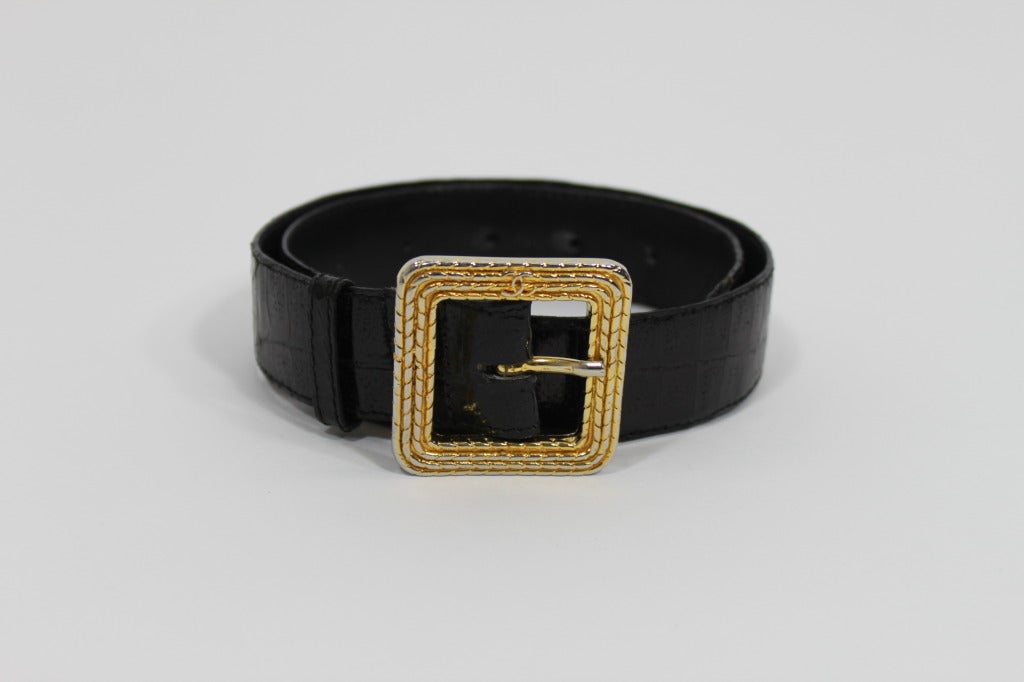 Black leather crocodile skin belt from CHANEL. Belt buckle is done in gold-tone, braided chain with delicate 