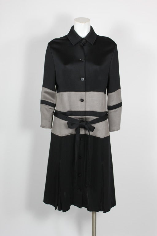 From a designer renowned for craftsmanship and attention to detail, this Chado Ralph Rucci jersey colorblock coat is minimal and chic. Pleats around the bottom lend the coat to swift movement. 

