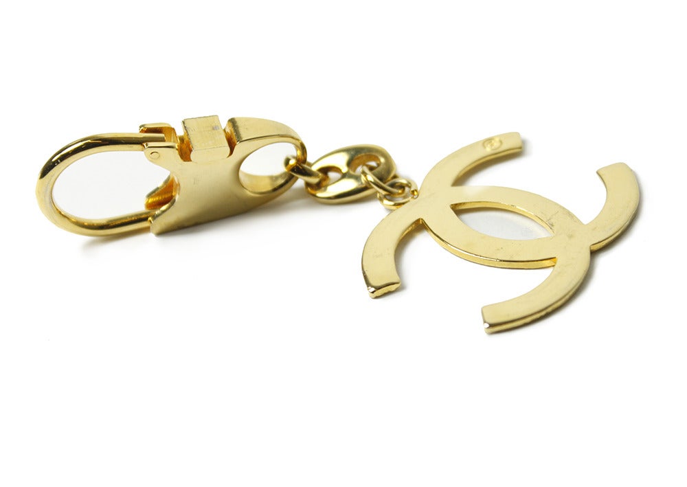 Chanel yellow metal key-fob with interlocking 