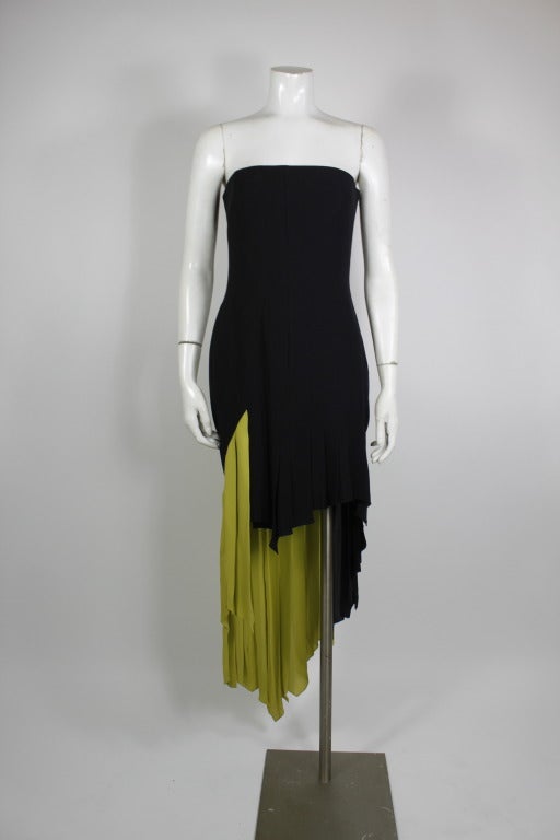 Strapless silk pleated cocktail dress from Versace couture done in black and chartreuse. Asymmetrical hemline and pleating.

-Side zip
-Full lined
-Asymmetrical hemline
-Strapless

Measurements--
Bust: 36 inches
Waist: 28 inches
Hip: 36