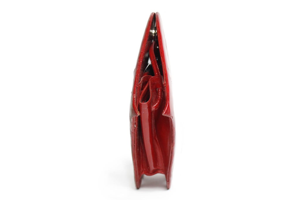 Spectacular, over-sized statement clutch in a caricature style by Andrea Pfister.  This fun Andrea Pfister piece features cut-outs on the red patent leather to mimic a lip puckering.  Lined in leather.  Optional double-straps and two small pockets