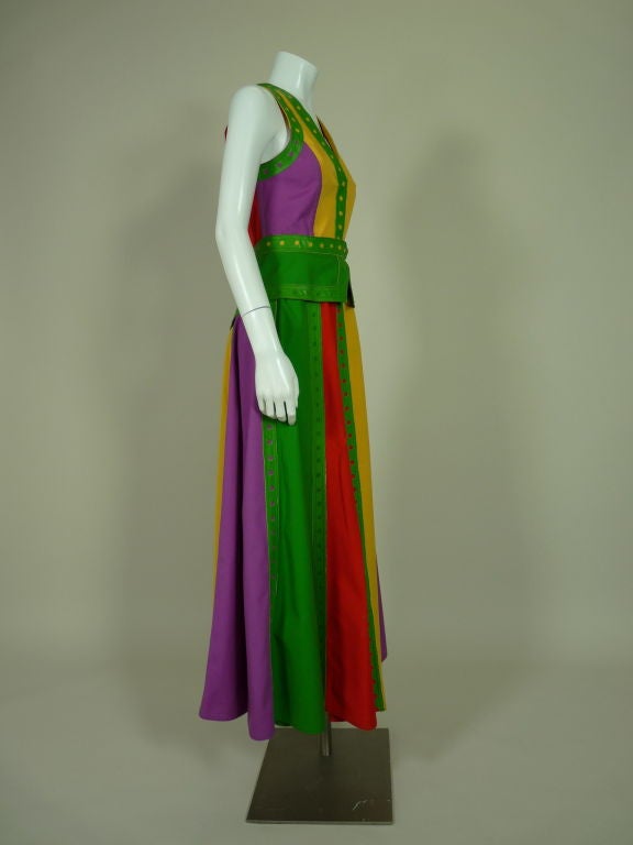 1970's vibrant color block cotton ensemble from Giorgio di Sant'Angelo. Fitted vest has a stylized peplum. Skirt is made from multicolored panels alternating between grass green, sunny yellow, red-orange and violet. Both vest and skirt are trimmed