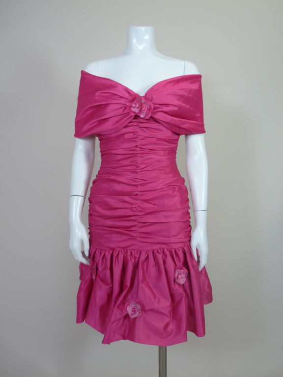 1980's fuschia silk organza party dress from Loris Azzaro.   Ultra form fitting dress is ruched at center front pulling the neckline into a sweetheart shape.  Ruching continues at side seams and center back. Bottom skirt panel is dotted with
