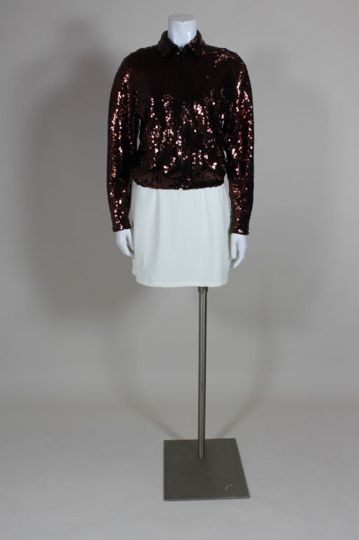 Fabulous sportswear inspired zip-front jacket from Halston is embroidered all-over with bronze and black striped metallic sequins on a jersey ground. Jacket is elasticized at hem and fully lined in silk.