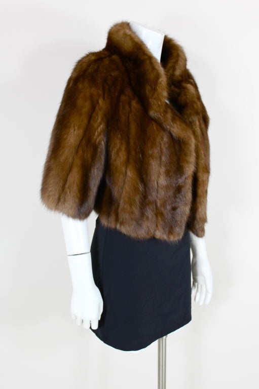 Gorgeous, rich sable fur jacket from I. Magnin has stand up collar and cropped sleeves. Fully lined.<br />
<br />
Measurements-<br />
Bust: 36”<br />
Hem: 44”<br />
Length Center Back to Hem: 19”<br />
Sleeve Length: 15”<br />
Shoulder to