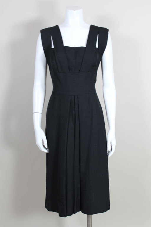 1940s gorgeous, lightweight linen party dress from famed American costume designer Adrian features his iconic structural avant-garde pleating. Cage-style panel straps wrap from under bust to the back over a box pleated bodice. Perfect for a summer