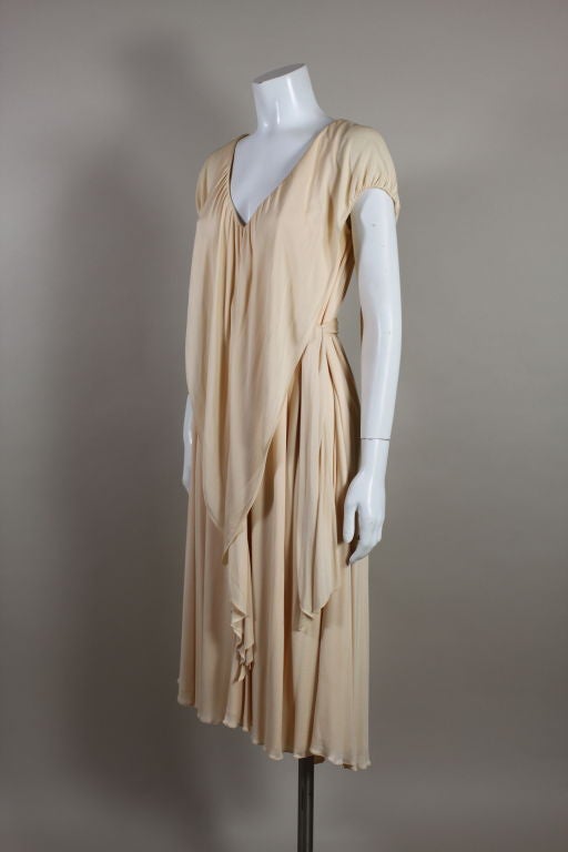 Holly's Harp sweet peach silk jersey dress.  Slightly trapeze with hanging panels that can be wrapped and/or twisted for various effects. Fun and flirty and worn by Sienna Miller to the Santa Barbara Film festival.<br />
<br />
<br />
<br />
<br