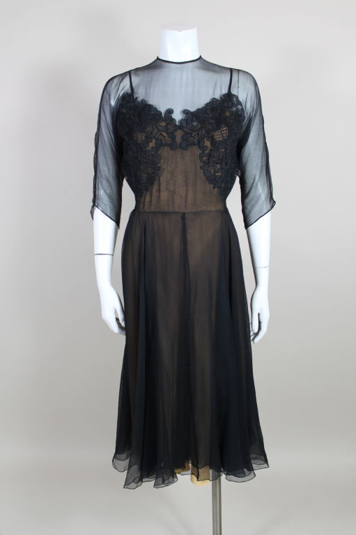 Gorgeous 1950's party dress from iconic American designer, Irene, is made from layered silk soufflé over a nude crepe lining. Sheer bodice has delicate appliqued lace over bust.<br />
<br />
Measurements--<br />
BUST: 32