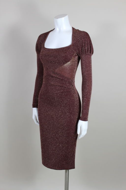 Ultra sexy, body-hugging dress from Vivienne Westwood is done in a stretchy wine red and gold lurex. Bodice has an illusion wrap silhouette, modified raglan sleeves and the iconic Westwood portrait collar. Measurements are flexible due to stretch.