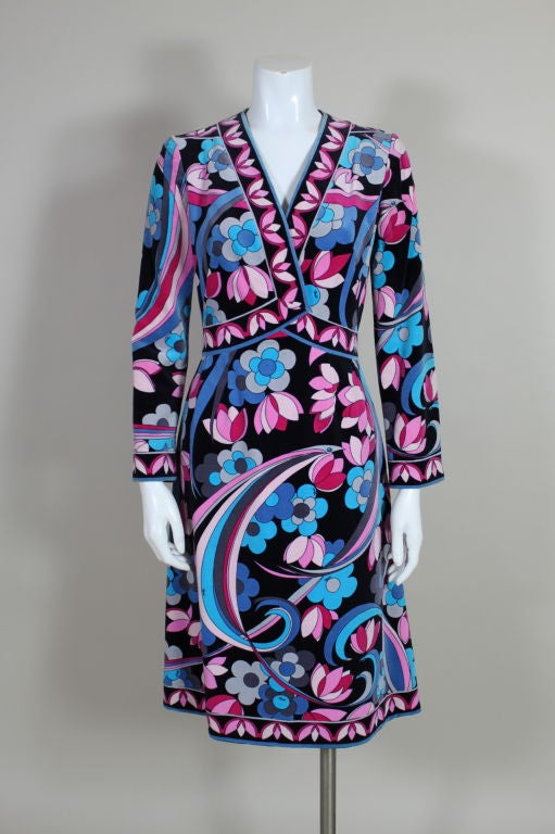 Gorgeous, plush Pucci dress is done in a Flower Power print cotton velveteen. Decorative wrap top is edged in pink lotus print. Zip back. 


