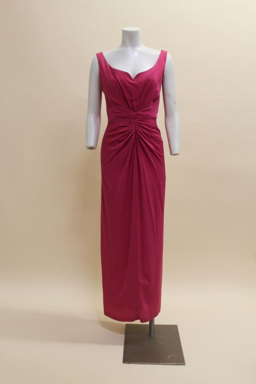 Gorgeous hot pink silk crepe gown from Valentino features radiating pleats from the waist in the style of a Roman goddess. Bodice has an elegant, sculpted sweetheart neckline reminiscent of Grace Kelly. Fully lined, zip back.