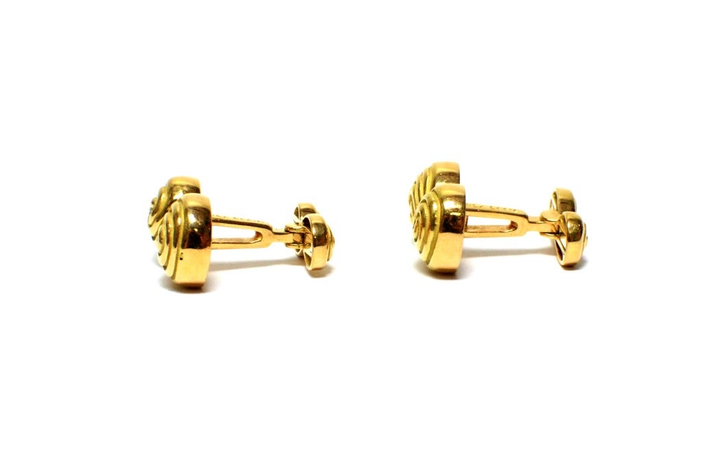 Designer: Tiffany & Co

Metal: 18k  Yellow Gold 

Style: Swirl Cufflinks 

Tiffany Box: Yes

Signed: Tiffany & Co