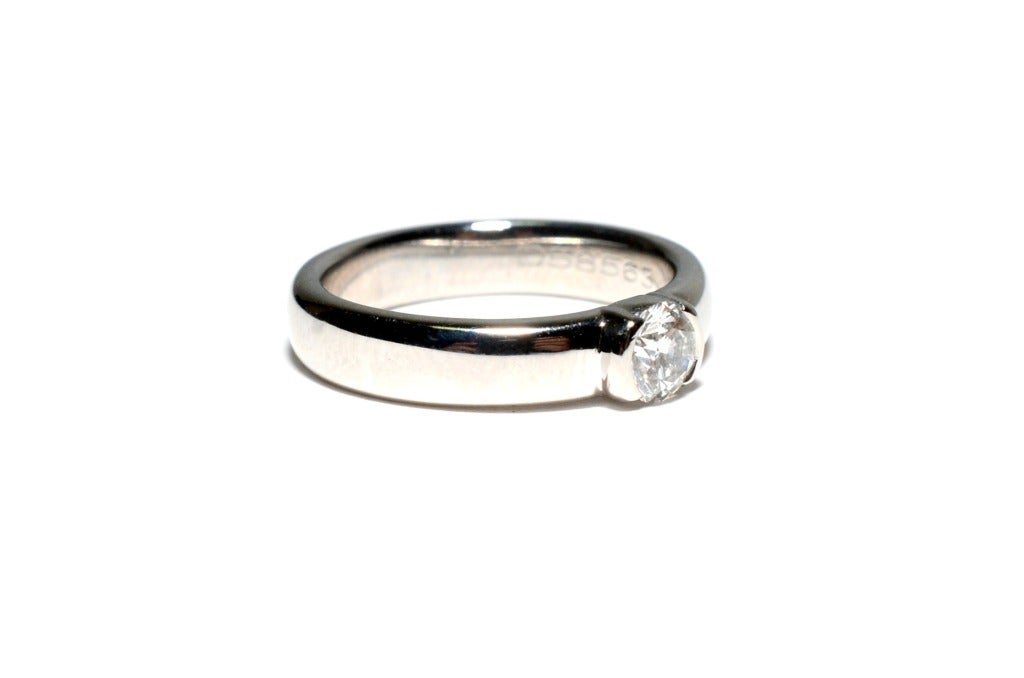 Brand:Tiffany & Co

Metal: PT950 Platinum

Style: Diamond Engament Ring

Diamond:  .41ct G-VS2.

Diamond Certificate : Tiffany & Co

Hallmarked: Tiffany & Co PT950 .41ct  D585**

Ring Size: 6