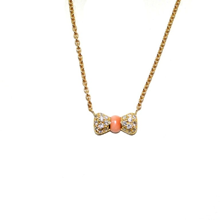Brand: VAN CLEEF & ARPELS VCA 
Metal:18K YELLOW GOLD
Diamond: .35tcw f-vs1
Stone: CORAL BOW NECKLACE
Style: DIAMOND CORAL BOW NECKLACE.
Hallmarks: VCA 750