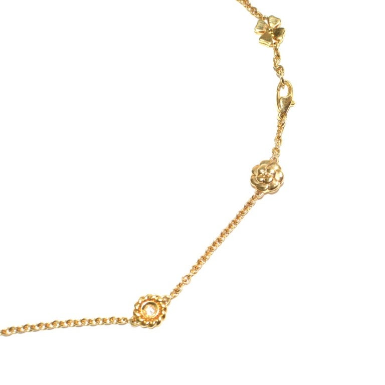 BRAND: Chanel 

STYLE: Camelia & Clover Diamond Necklace.

METAL: 18K  Yellow Gold

DIAMONDS: 4 Diamonds

DIAMOND WEIGHT: Approx .60tcw

LENGTH: 16