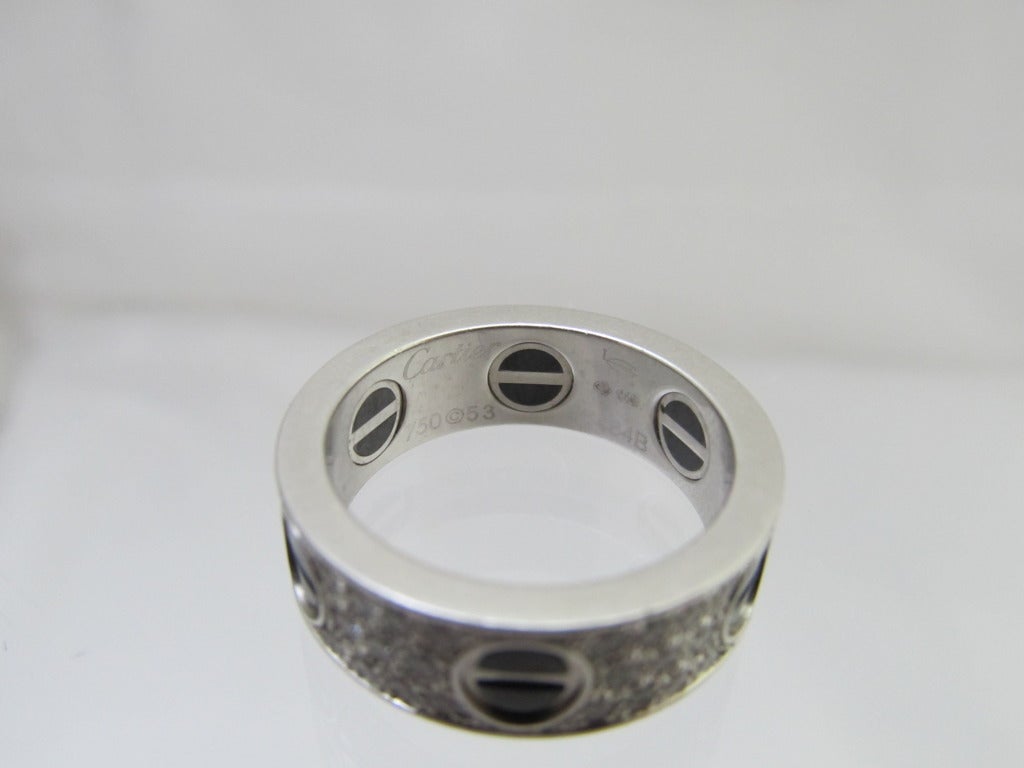 18k White Gold Pave Diamond Black Ceramic Love Ring by Cartier.
Size: 53
Width - 7mm
Origin:	Cartier -	France  1990's
Metal: 	18K Gold 
Total diamond weight is 1carat
Signed:  CARTIER # 56484B