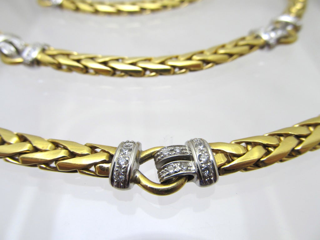 Beautiful long gold & diamond necklace.
 Flat link necklace with 10 white gold buckle style sections encrusted with brilliant diamonds
Total diamond weight is 3.60carats
Necklace length is 35.5 inches
Gold weight is 160gm
 18k gold