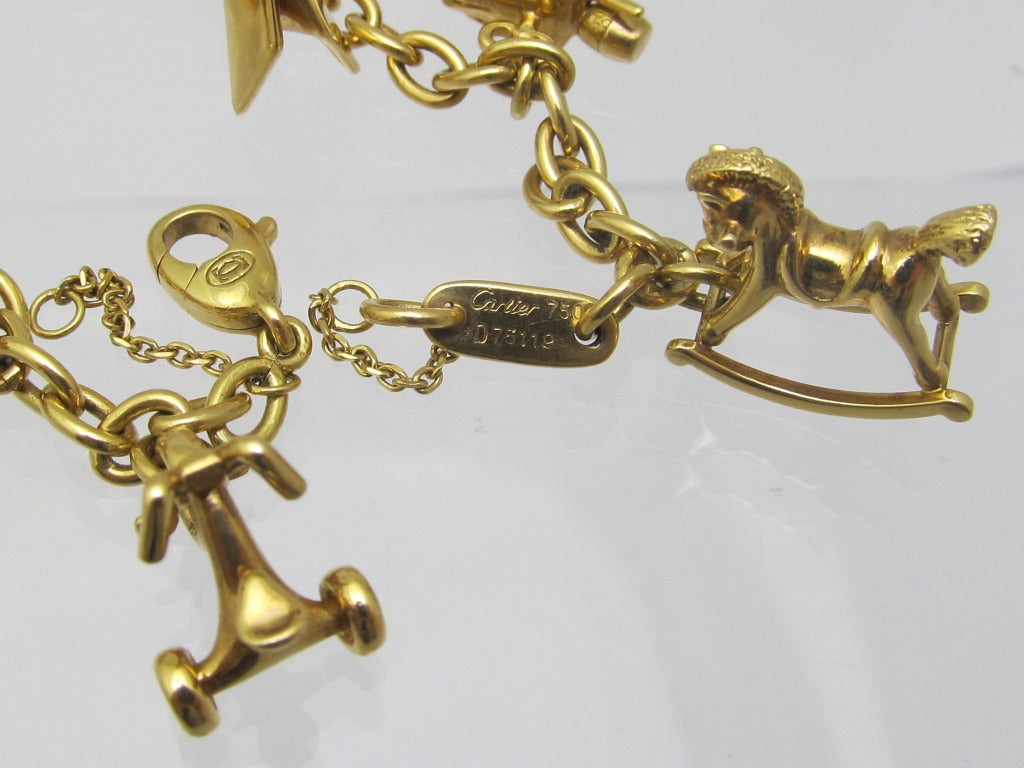 Cartier Charm Bracelet  18 k gold with 7 charms