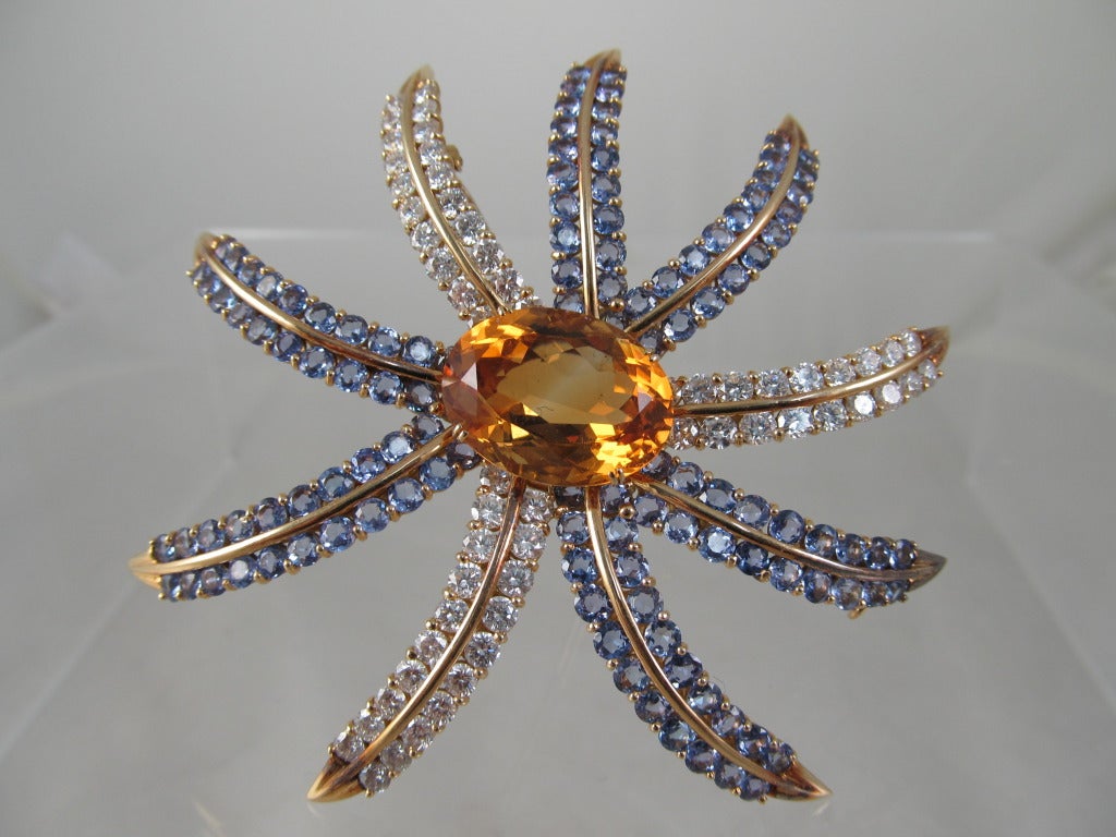 Impressive 18K yellow gold, Citrine, Tanzanite & Diamond Brooch. 
Features at its center an oval shape Citrine  approx 25carats,  6 carats of fine quality Diamonds & 7carats of round shape Tansanites 
3