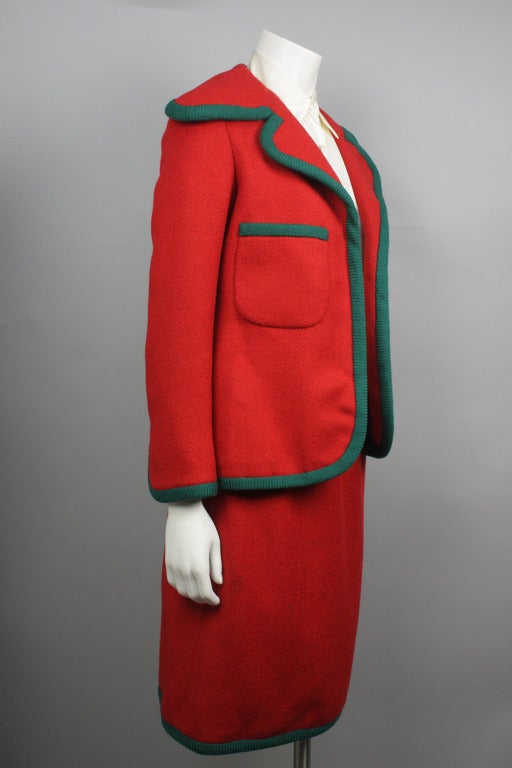 SALE! Originally $750

Bright blazer and skirt in red wool with green trim. Rayon lining. Shirt on display is not included with the suit.