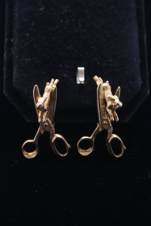 A clever and lighthearted piece! These earrings are a costume piece cast from vintage collectible silver Chim charms that Binns assembled in Dada-influenced compositions. The final product are themselves costume metal with gold wash. A fun and