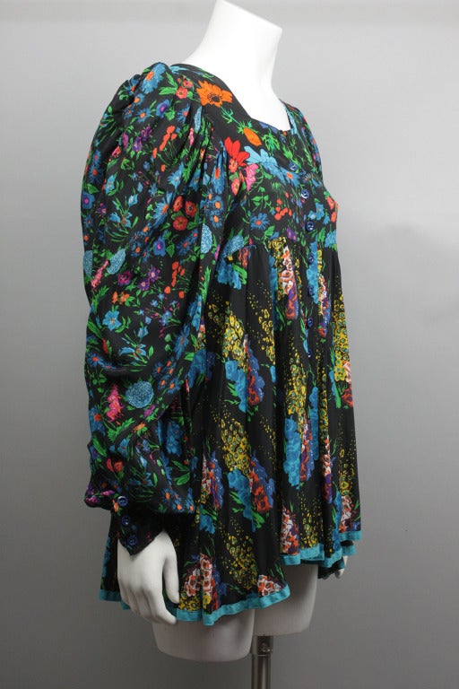 Print mini dress by Jeff Banks-- a contemporary of Ossie Clark and Jean Muir-- in pure 1960s Carnaby St style. Mismatched floral pattern on skirt and bodice with large billowing sleeves that end in a tight cuff.