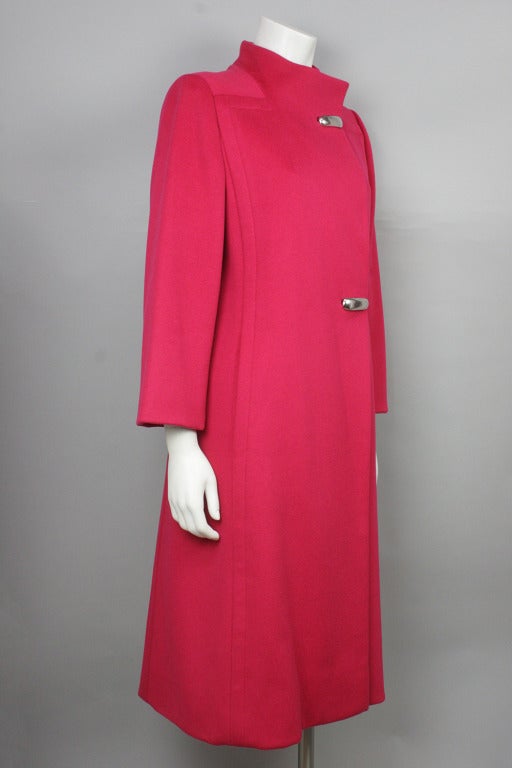 SALE 45% OFF! Original price $725

Bright pink coat with a beautiful tailored shape. Two silver toggle buttons and stand up collar.