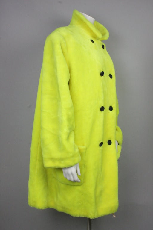 Lightweight double breasted mens neon faux fur coat; can be buttoned on either the right or left side for a unisex fit. Short pile knit of modacrylic fiber.