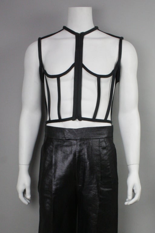Men's iconic Jean Paul Gaultier vest with boned cage front. Circa Gaultier's work for Madonna's Blond Ambition tour. Zip front and back D-ring buckle adjustment. A rare find and special piece!