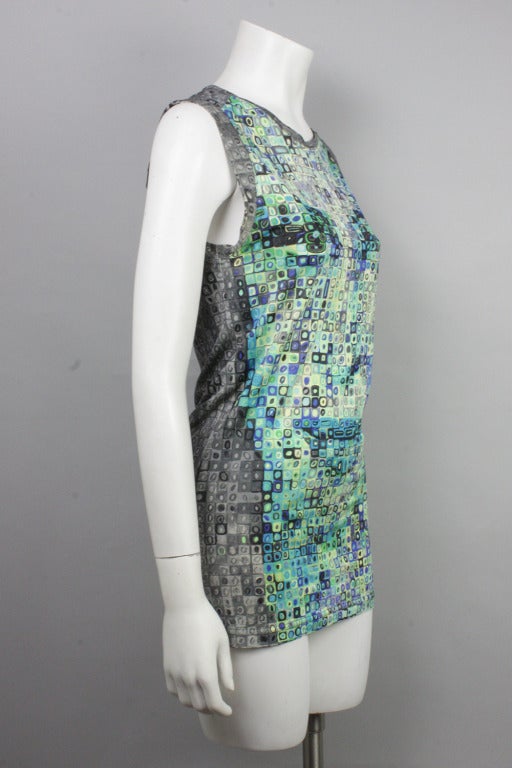 Turquoise tank top with a Chuck Close inspired-print of Donatella Versace's face, discernible from a distance. The pattern continues in gray on the back. Stretch fabric.