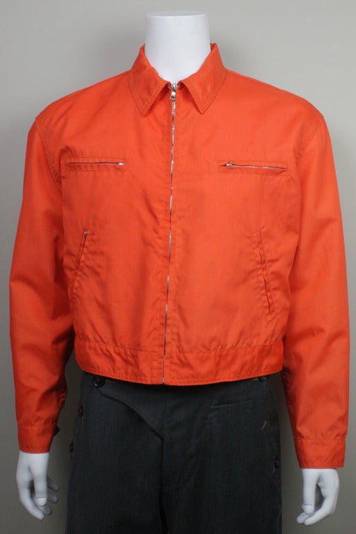 Men's orange nylon work-wear style bomber jacket from Helmut Lang's SS 1991 collection. Four zippered pockets.