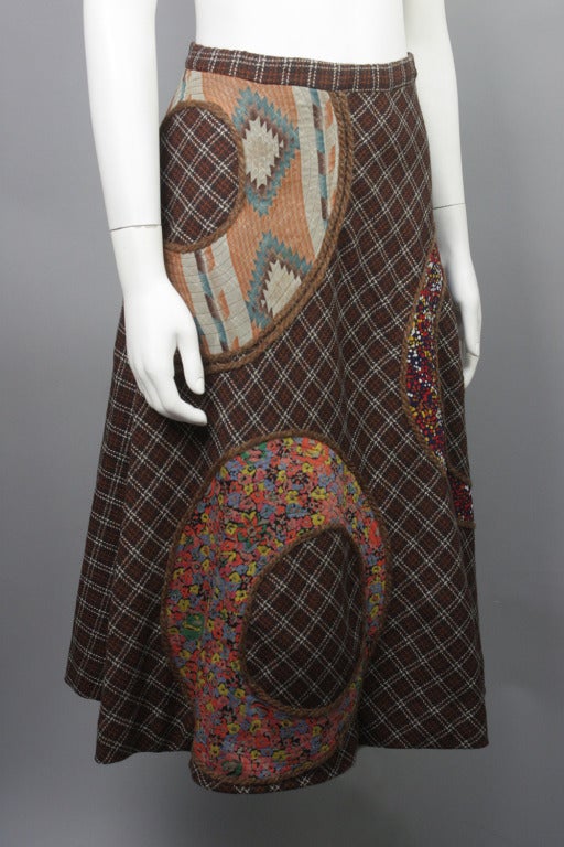 50% OFF! Originally $495

Full brown, rust and cream colored plaid skirt with three large patchwork appliques in various patterns trimmed in yarn. Fully lined.