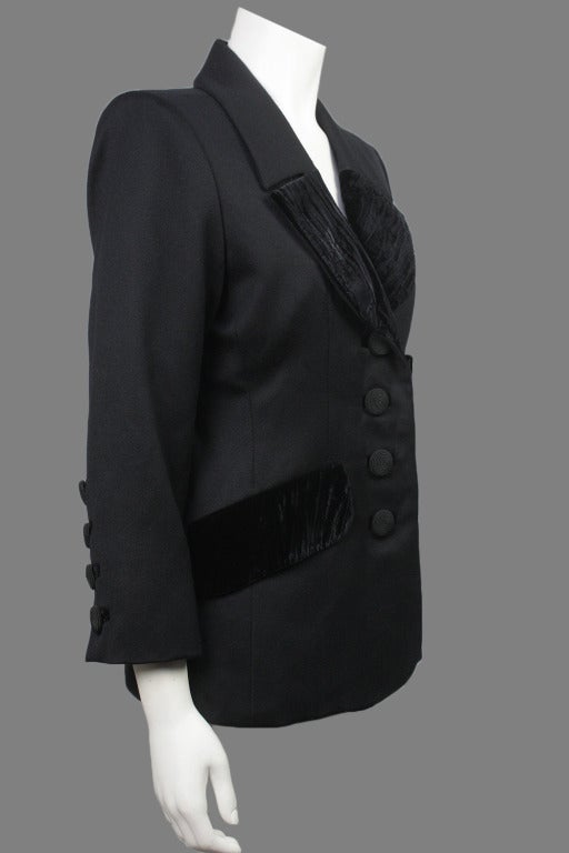 Originally $850!!

1970s YSL Rive Gauche fitted wool jacket with beautiful black velvet accents at the collar and front pockets. Four spiral design buttons down the front as well as on the sleeves.