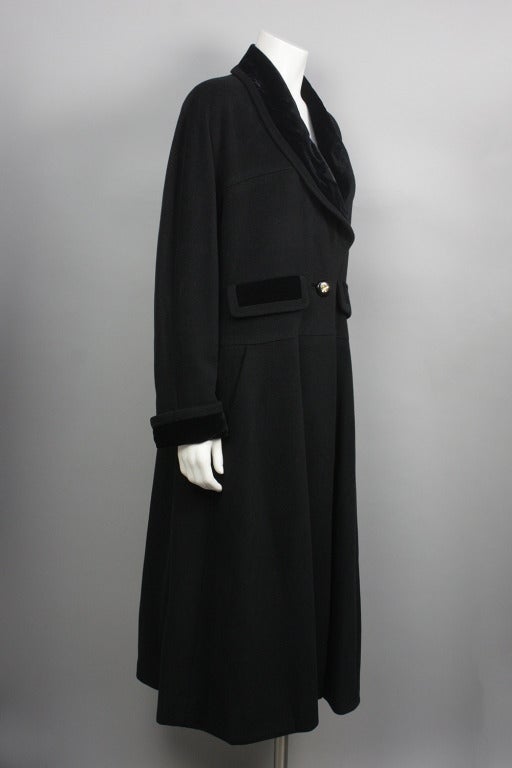 10% OFF! Originally $3,900

Luxuriously soft cashmere coat with velvet trim above pockets, at collar, and cuffs. Flattering and timeless shape. Buttons with goldtone four leaf clover: one at front and five at back vent. There is a second hidden