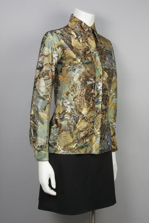 Women's button down blouse with wide collar and woodsy hunter-style camo print featuring robins.