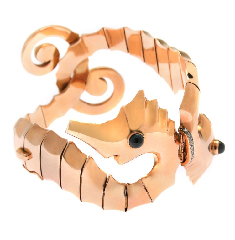 This is a gorgeous bracelet in rose gold with saphires and diamonds.  The construction is beautiful