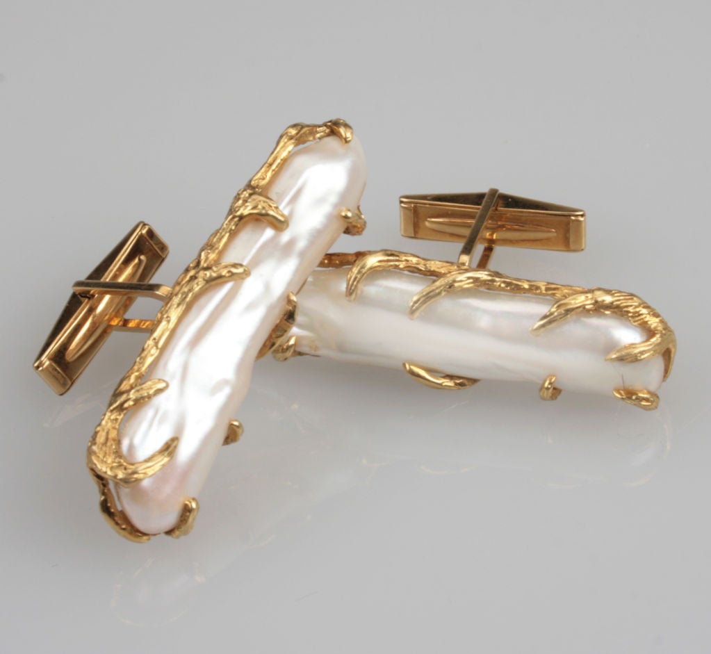 These are a beautiful pair of organic elongated pearl cuff links.  They are marked marked B. A. for Barbara Anton.