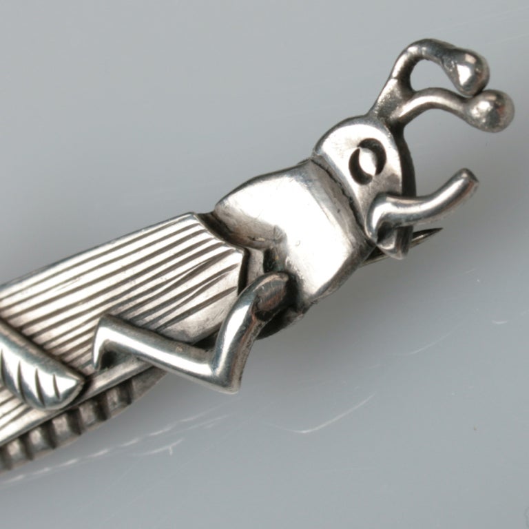 This is an early brooch by Master Silversmith Hector Aguilar.  It is made of high grade silver bearing the 990 mark, Taxco and the makers mark of HA.