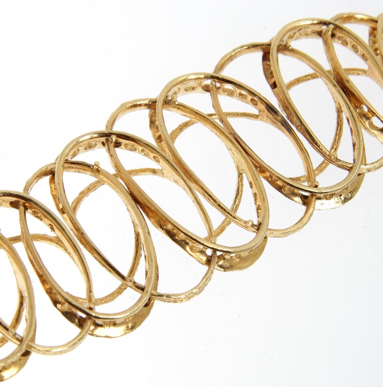 This is a great looking modern bracelet.  The graduated ovals have a Florentined finish.