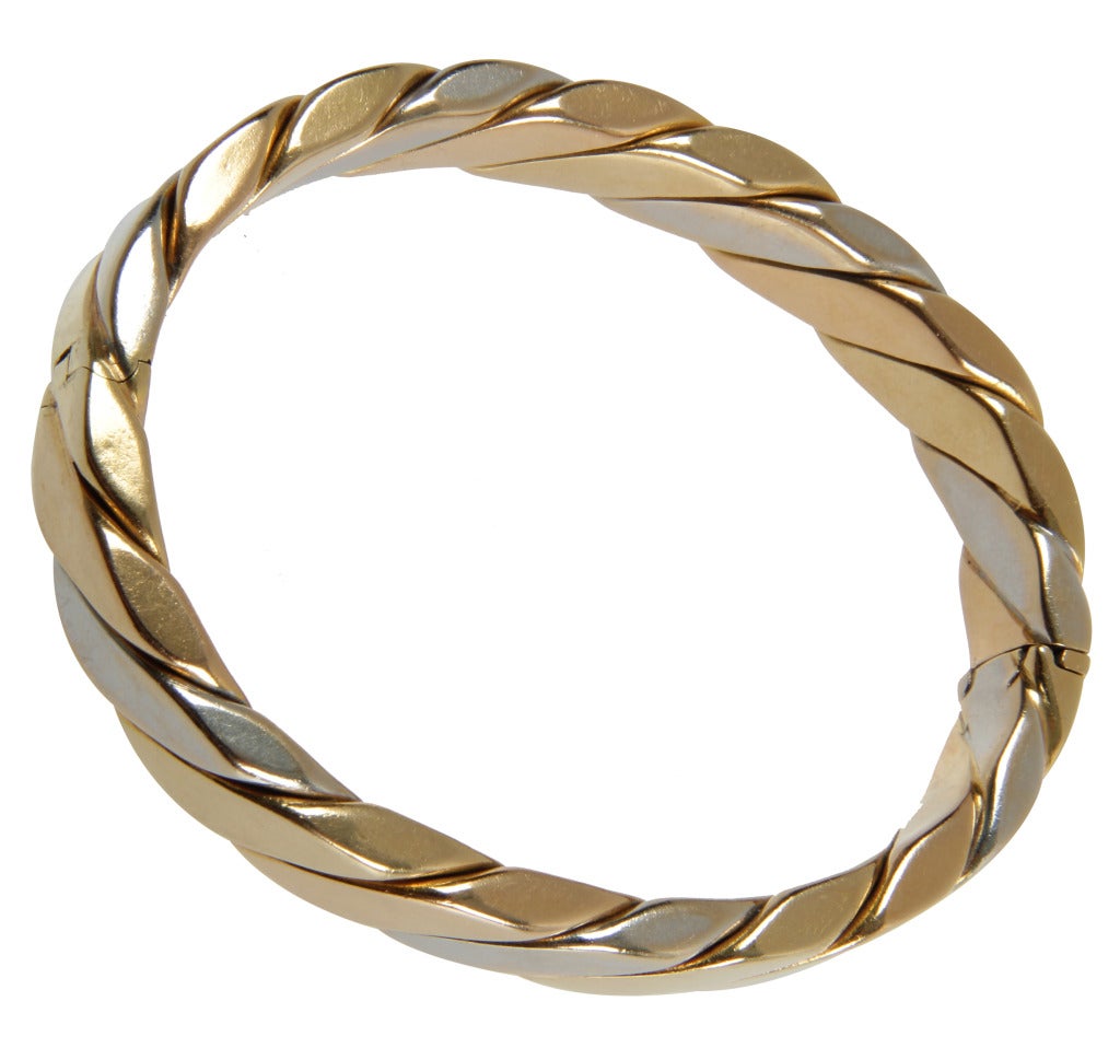 This is a handsome and  easy to wear bracelet in alternating gold and white gold.  Quite substantial, the interior circumference is 6.50 inches.
