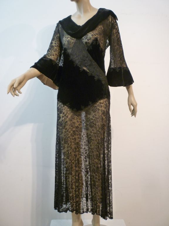 A beautiful 1930s dress/lingerie piece made of delicate silk lace and black velvet that has been appliqué embroidered to the lace at midriff, collar and cuffs. Absolutely beautiful!  Size 2-4